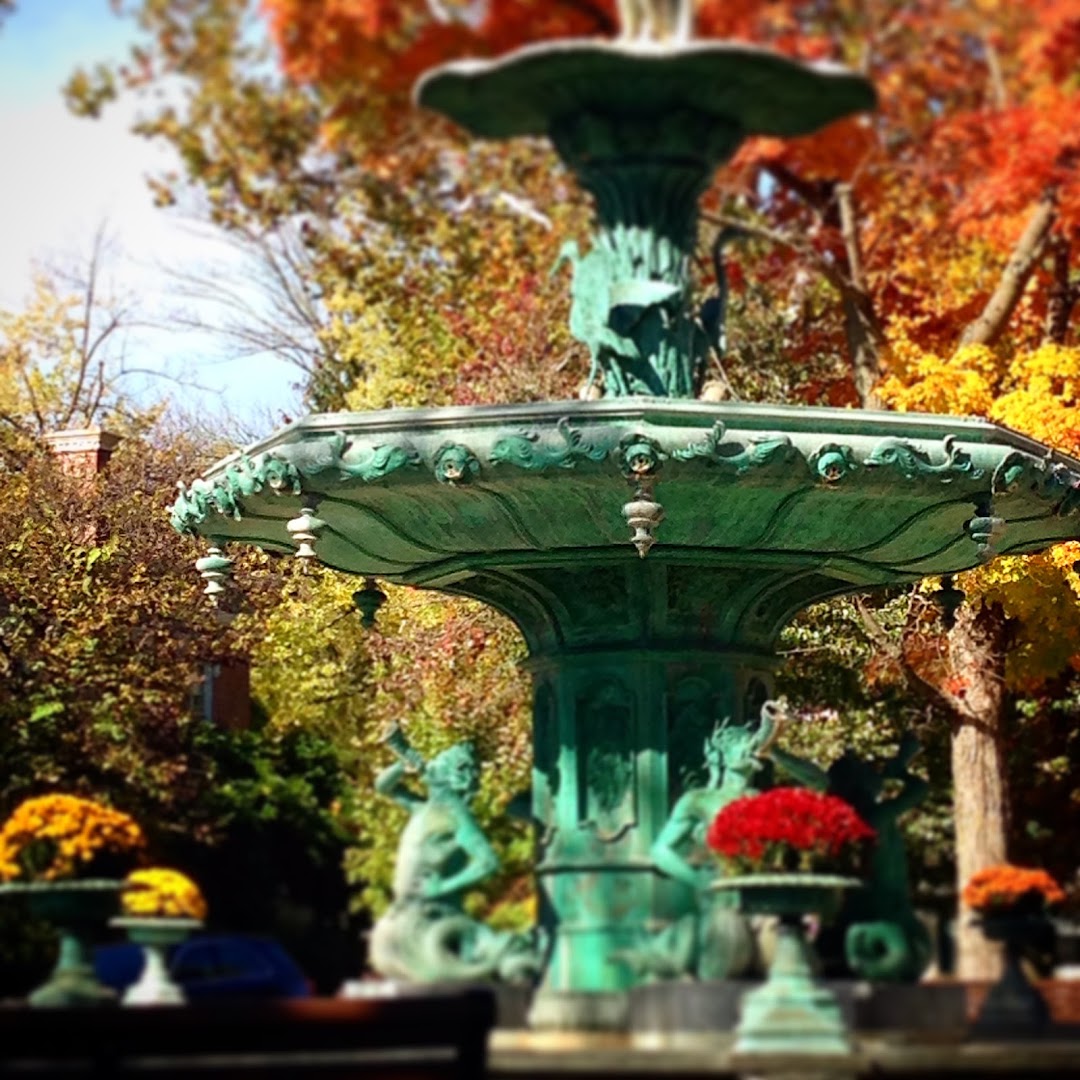 The Broadway Fountain in downtown Madison surrounded by autumn trees